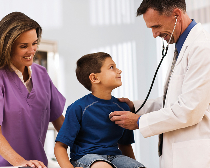 child with a doctor and nurse